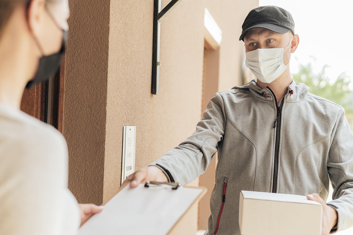close-up-delivery-man-with-package-min